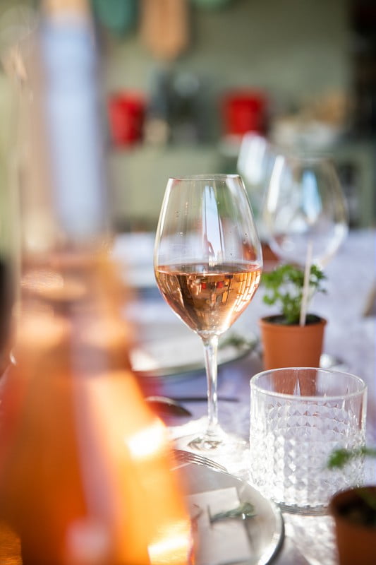 [a glass or pink rosé wine on a table with bottle in foreground] avignon wine tours, wine tours avignon, half day wine tour avignon. rhone wine tours from avignon, rhone valley wine tour from avignon wine tasting in avignon, wine tasting near avignon, wine tasting avignon