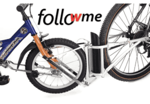 [a promotional image of a child's bike attached to an adult back with a tandem mechanism]